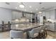 Modern gray kitchen with a large island, granite countertops and stainless steel appliances at 18865 W Mescal St, Surprise, AZ 85388