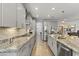 Spacious kitchen with gray cabinets, granite countertops, and a stainless steel appliance package at 18865 W Mescal St, Surprise, AZ 85388