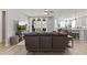 Open-concept living room with comfortable seating and views of the outdoor space at 18865 W Mescal St, Surprise, AZ 85388