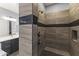 Custom tile shower showcasing bronze fixtures and a built-in shower seat at 18865 W Mescal St, Surprise, AZ 85388