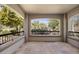 The covered balcony features tile floors and wrought iron railing with scenic views at 19700 N 76Th St # 1103, Scottsdale, AZ 85255
