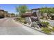 Inviting community entrance with stone signage and landscaping at The Village at Grayhawk North 8700 at 19700 N 76Th St # 1103, Scottsdale, AZ 85255