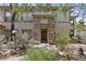 Charming home featuring a stone pillar entrance and well-maintained desert landscaping at 19700 N 76Th St # 1103, Scottsdale, AZ 85255