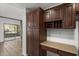 Kitchen featuring dark wood cabinetry and an adjacent dining area at 19700 N 76Th St # 1103, Scottsdale, AZ 85255