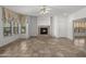 Bright living room with a decorative fireplace and large windows at 19700 N 76Th St # 1103, Scottsdale, AZ 85255