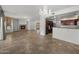 Open-concept living and kitchen area featuring tile floors and natural light at 19700 N 76Th St # 1103, Scottsdale, AZ 85255