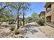Community walking path with beautiful desert landscaping and multiple residential buildings at 19700 N 76Th St # 1103, Scottsdale, AZ 85255