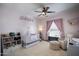 Cozy pink Bedroom featuring crib, soft textures, and whimsical decor at 19700 N 76Th St # 2057, Scottsdale, AZ 85255