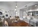 Open floor plan showcasing the dining area with views of the living room and modern kitchen features at 19700 N 76Th St # 2057, Scottsdale, AZ 85255