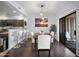 Dining area featuring stylish lighting, modern décor, and a smooth transition to the kitchen at 19700 N 76Th St # 2057, Scottsdale, AZ 85255