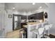 Well-equipped kitchen boasts stainless steel appliances, breakfast bar, and dark cabinets for modern functionality at 19700 N 76Th St # 2057, Scottsdale, AZ 85255