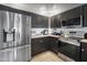Close-up of modern kitchen featuring stainless steel appliances and sleek dark cabinetry at 19700 N 76Th St # 2057, Scottsdale, AZ 85255