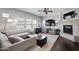 Bright living room featuring a fireplace, ceiling fan, and ample seating for entertainment and relaxation at 19700 N 76Th St # 2057, Scottsdale, AZ 85255
