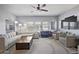 Spacious living room with a large sectional sofa, accent chairs, and modern decor for a comfortable gathering space at 19700 N 76Th St # 2057, Scottsdale, AZ 85255