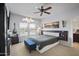 Stylish main bedroom with ceiling fan, unique artwork and modern floating bedside tables at 19700 N 76Th St # 2057, Scottsdale, AZ 85255