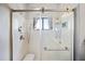 Close up of large shower with seating, hand shower, and framed glass door at 19700 N 76Th St # 2057, Scottsdale, AZ 85255
