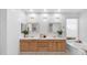 Bright bathroom featuring a double vanity, white subway tile, and a soaking tub at 1991 W Bartlett Ct, Chandler, AZ 85248