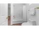 Small bathroom features bathtub and shower combo, brass fixtures and tile flooring at 1991 W Bartlett Ct, Chandler, AZ 85248