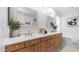 Bright bathroom with a double vanity, tile floor, and modern decor at 1991 W Bartlett Ct, Chandler, AZ 85248