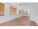Bright bedroom features wood-look flooring, and sliding closet doors reflecting more space at 1991 W Bartlett Ct, Chandler, AZ 85248