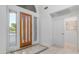 Inviting entryway with tiled floor design, glass door, and natural light at 1991 W Bartlett Ct, Chandler, AZ 85248