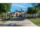 Stunning two-story home with arched entry, mature trees and an attached two-car garage at 1991 W Bartlett Ct, Chandler, AZ 85248