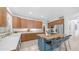 Bright kitchen boasts wood cabinets, stainless steel appliances, butcher block island with bar seating at 1991 W Bartlett Ct, Chandler, AZ 85248