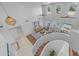 Open-concept living room boasts soaring ceilings, bright airy windows, and easy access to outdoor pool at 1991 W Bartlett Ct, Chandler, AZ 85248