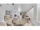 Open concept living and dining area features fireplace, neutral colors, and lots of light at 1991 W Bartlett Ct, Chandler, AZ 85248