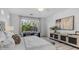 Bright main bedroom with a window view, light walls, and modern furnishings at 1991 W Bartlett Ct, Chandler, AZ 85248