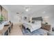 Spacious main bedroom with a decorative rug, wood-look floors, and ample natural light at 1991 W Bartlett Ct, Chandler, AZ 85248