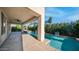 Inviting swimming pool and covered patio, perfect for outdoor relaxation and entertaining, with lush, mature landscaping at 1991 W Bartlett Ct, Chandler, AZ 85248