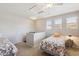 Loft featuring twin beds, bright windows with blinds, ceiling fan, and an open layout at 20100 N 78Th Pl # 2193, Scottsdale, AZ 85255