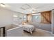 Charming bedroom featuring a floral bedspread, natural light and a rustic barn door at 20100 N 78Th Pl # 2193, Scottsdale, AZ 85255