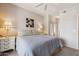 This bedroom features a ceiling fan and two nightstands with lamps, creating a cozy and well-lit space at 20100 N 78Th Pl # 2193, Scottsdale, AZ 85255