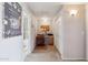 Hallway showcases a work station, adjacent bathroom, closet, and decor details to personalize the space at 20100 N 78Th Pl # 2193, Scottsdale, AZ 85255