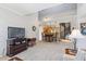 Open-concept living space with breakfast bar, cozy kitchen, and spiral staircase that leads to upper level at 20100 N 78Th Pl # 2193, Scottsdale, AZ 85255