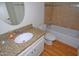 Bright bathroom featuring a granite countertop, bathtub, and a tile backsplash at 2015 E Southern Ave # 23, Tempe, AZ 85282