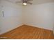 Bedroom features wood floor, ceiling fan and a window with blinds at 2015 E Southern Ave # 23, Tempe, AZ 85282