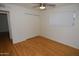 Cozy bedroom with wood floors, a ceiling fan, a window with blinds and a closet at 2015 E Southern Ave # 23, Tempe, AZ 85282