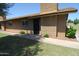 Inviting front entrance of a brick home with a secure screen door at 2015 E Southern Ave # 23, Tempe, AZ 85282