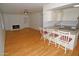 Open-concept living space with a brick fireplace and modern kitchen at 2015 E Southern Ave # 23, Tempe, AZ 85282