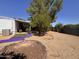 Serene backyard featuring an above-ground pool, gravel landscaping, and a fire pit at 20644 N 36Th Ave, Glendale, AZ 85308