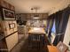Eat-in dining area with a wooden table set and built-in cabinets at 20644 N 36Th Ave, Glendale, AZ 85308