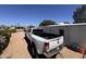 Back view of a white truck parked in the driveway, with metal trailer hitch at 20644 N 36Th Ave, Glendale, AZ 85308