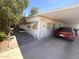 Cozy home with a covered parking area and a paved walkway to the front door at 20644 N 36Th Ave, Glendale, AZ 85308