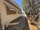 Mobile home with a walkway and landscaping that offers some shade at 20644 N 36Th Ave, Glendale, AZ 85308