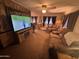 Comfortable living room features a mounted TV and lots of seating at 20644 N 36Th Ave, Glendale, AZ 85308