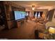 Comfortable living room features a mounted TV and lots of seating at 20644 N 36Th Ave, Glendale, AZ 85308
