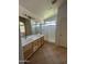 Bathroom with dual sink vanity and walk-in shower at 2092 E Smoke Tree Rd, Gilbert, AZ 85296